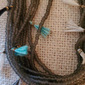 Grey Beaded Necklace with white blue turquoise tassels  Anthropologie